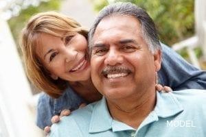Older hispanic could smiling and embracing sf oral surgery