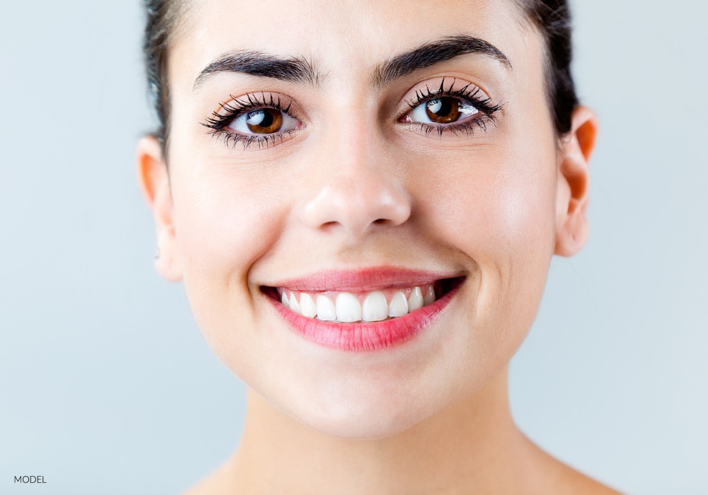 Close up of woman with a big smile and white teeth sf oral surgery